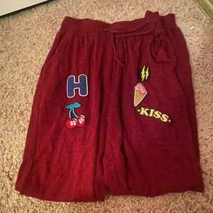 Red sweat pants with patches